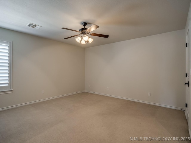 carpeted empty room featuring ceiling fan