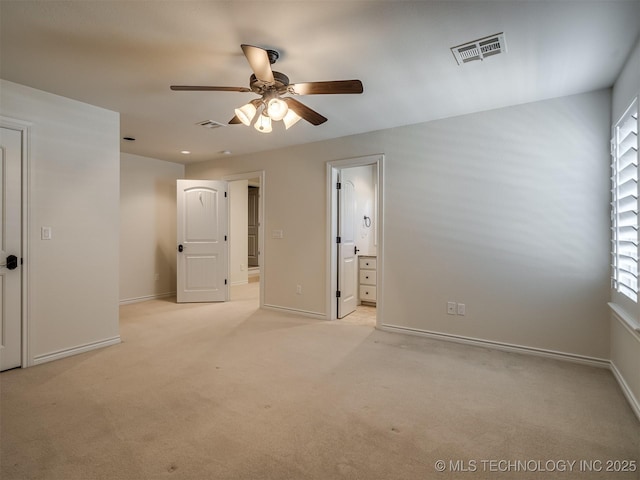 empty room featuring light carpet and ceiling fan