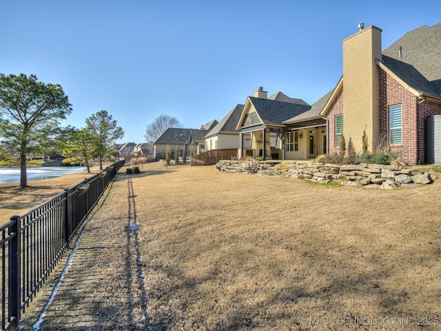 view of yard featuring a water view