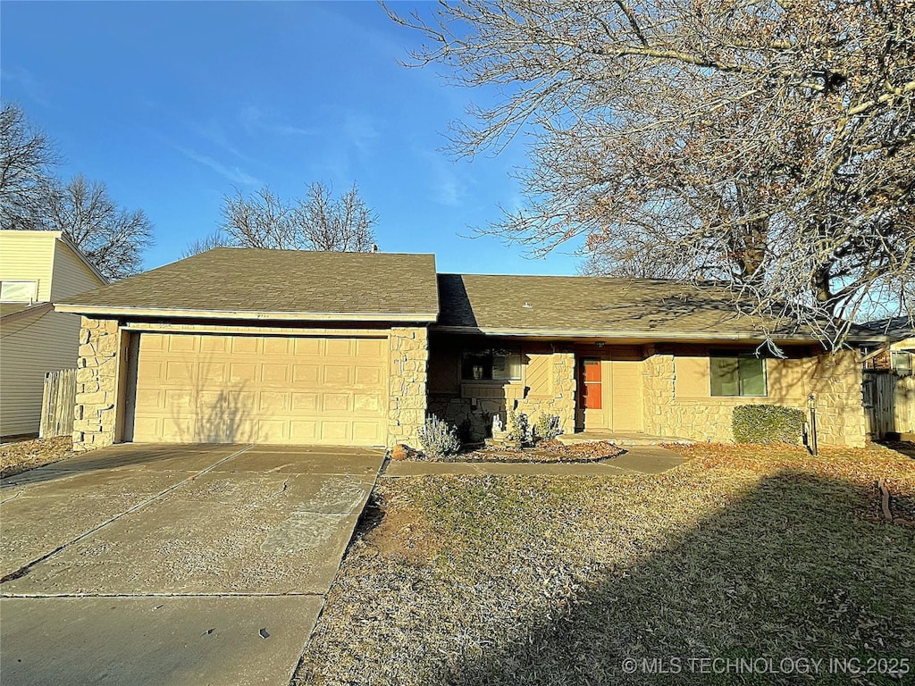 ranch-style house featuring a garage