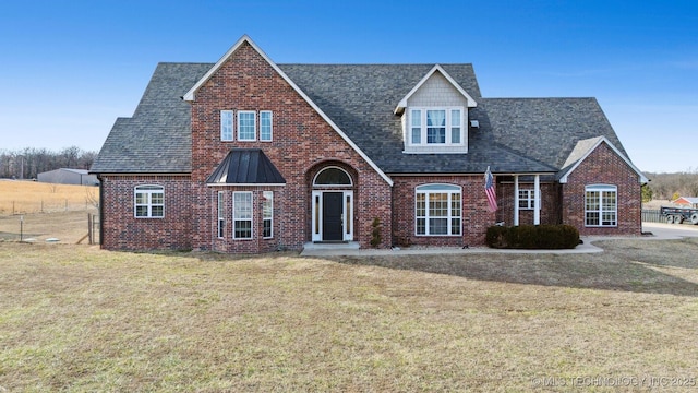 view of front of home with a front yard