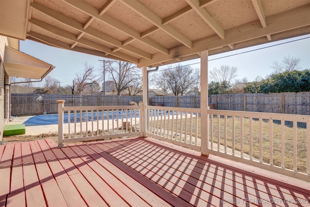 wooden terrace with a covered pool