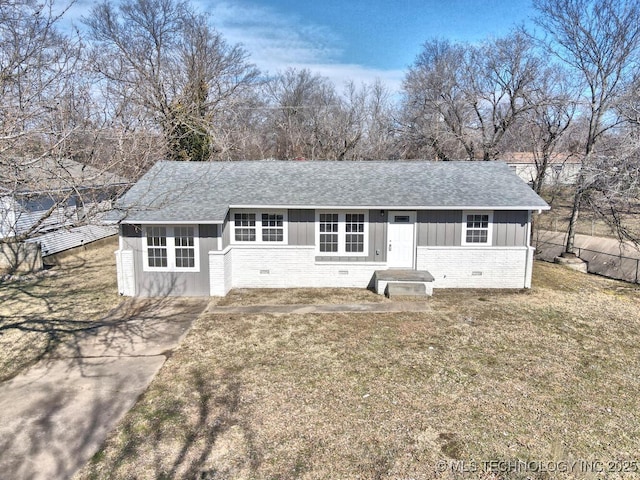 ranch-style house with a front lawn