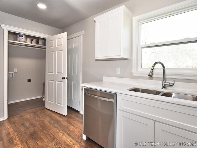 kitchen with white cabinetry, dishwasher, sink, and dark wood-type flooring