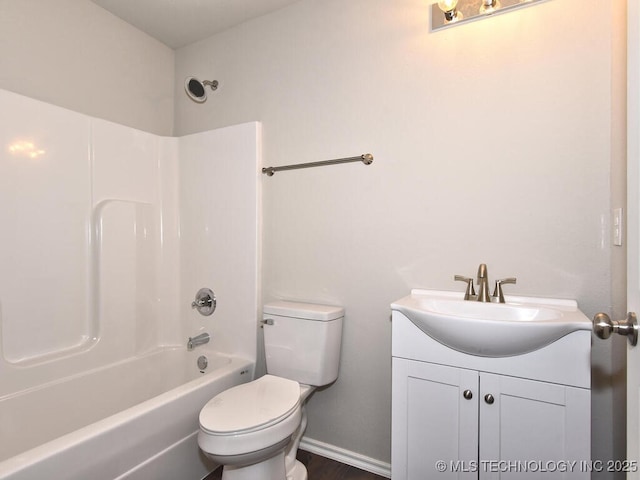 full bathroom with bathtub / shower combination, vanity, and toilet