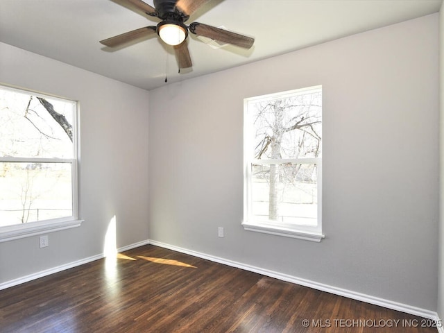 unfurnished room with dark wood-type flooring, a wealth of natural light, and ceiling fan