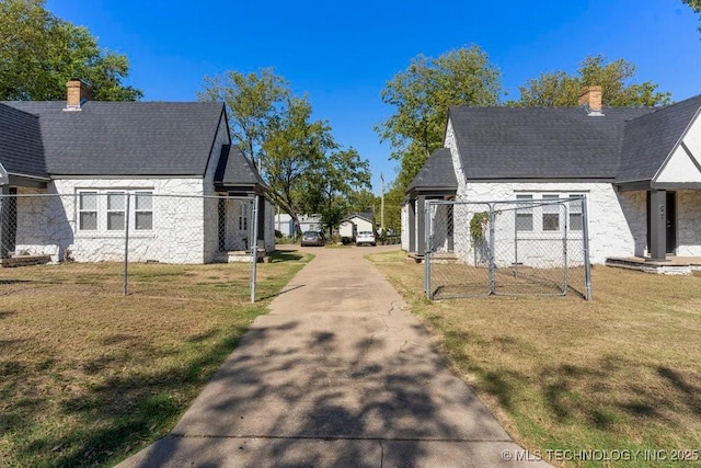 view of side of property featuring a yard