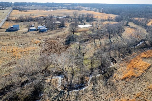 birds eye view of property with a rural view