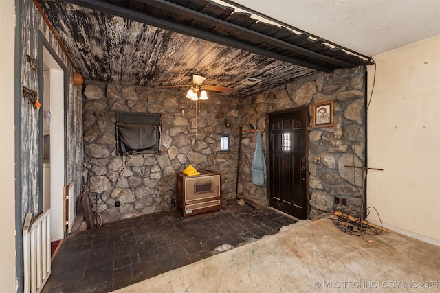 foyer with wood ceiling, ceiling fan, and beam ceiling