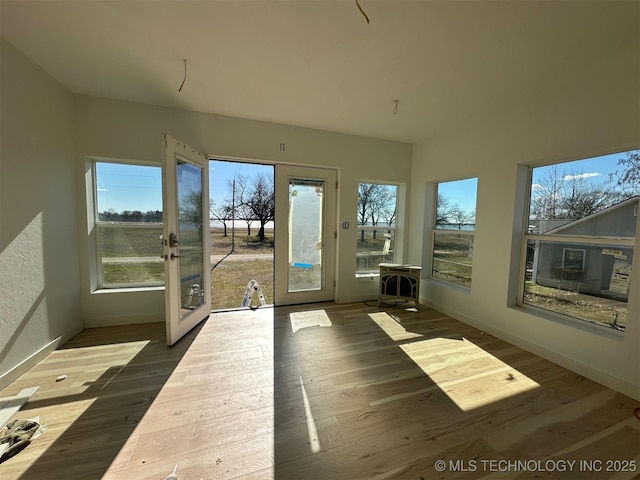 unfurnished sunroom featuring french doors