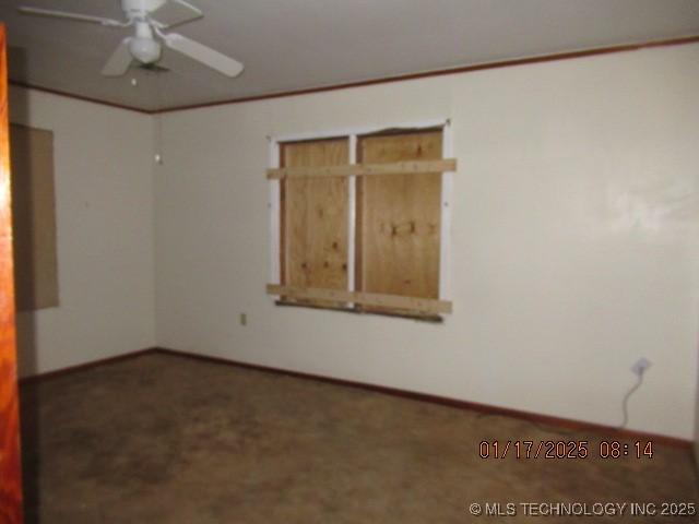 spare room with ceiling fan