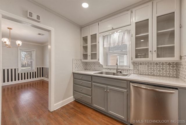 1531 S Florence Ave, Tulsa, OK 74104 - kitchen with dishwasher, sink, hanging light fixtures, hardwood / wood-style flooring, and gray cabinetry