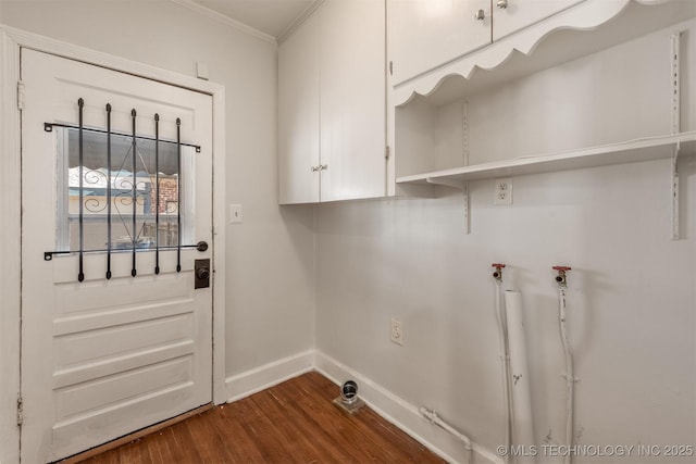 1531 S Florence Ave, Tulsa, OK 74104 - washroom with crown molding, cabinets, and dark hardwood / wood-style floors