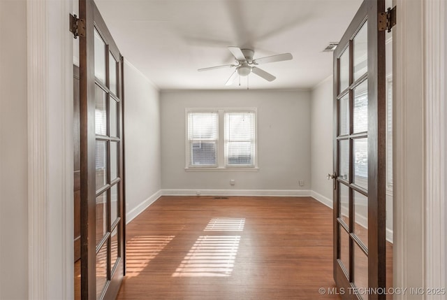 1531 S Florence Ave, Tulsa, OK 74104 - empty room featuring crown molding, hardwood / wood-style flooring, ceiling fan, and french doors