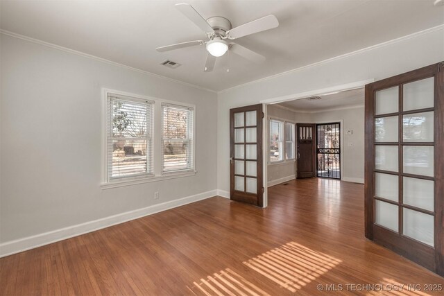 1531 S Florence Ave, Tulsa, OK 74104 - spare room with ceiling fan, french doors, crown molding, and dark hardwood / wood-style flooring