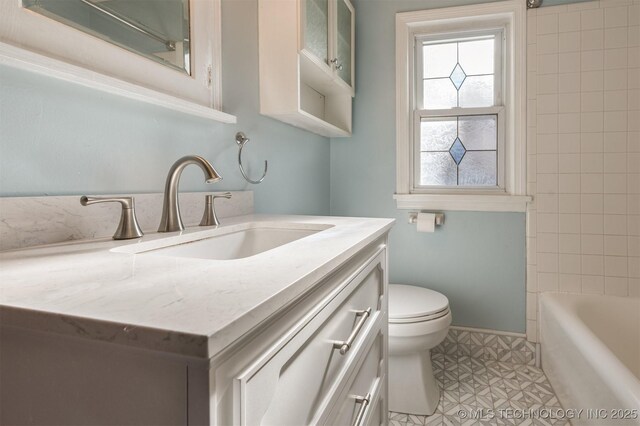 1531 S Florence Ave, Tulsa, OK 74104 - full bathroom featuring toilet, vanity, tiled shower / bath combo, and tile patterned flooring