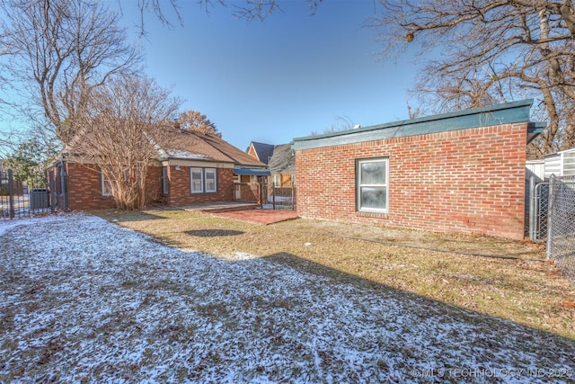 1531 S Florence Ave, Tulsa, OK 74104 - rear view of property featuring a yard