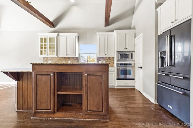 kitchen featuring white cabinetry, stainless steel appliances, and a kitchen island