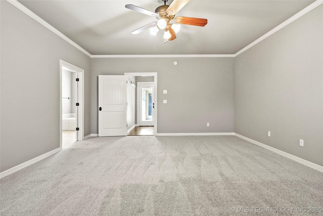 empty room featuring ceiling fan, light carpet, and crown molding