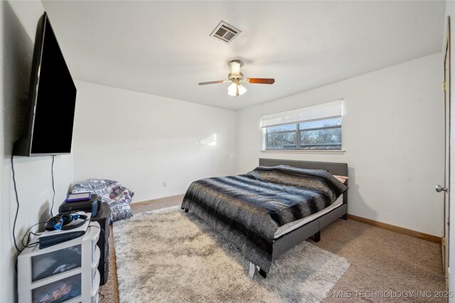 bedroom with ceiling fan and carpet