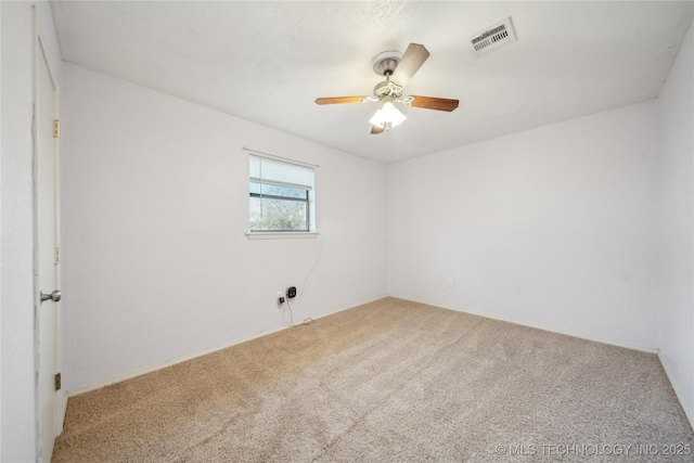 carpeted empty room with ceiling fan