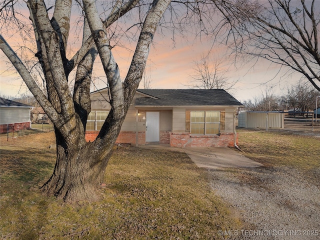 view of front of home with a yard