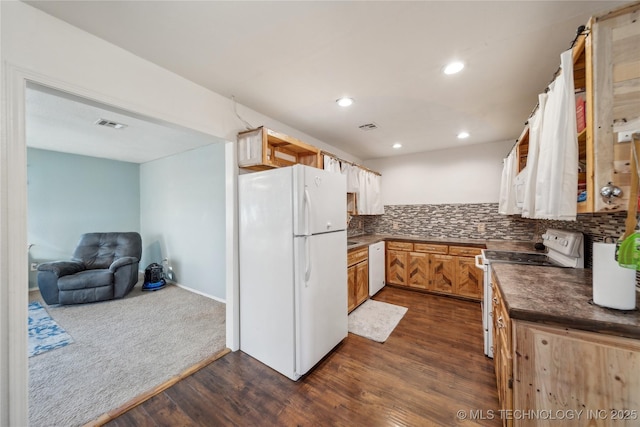 kitchen with white appliances, decorative backsplash, and dark hardwood / wood-style floors