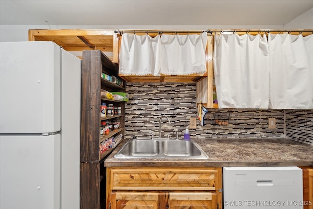 kitchen with sink, white appliances, and tasteful backsplash