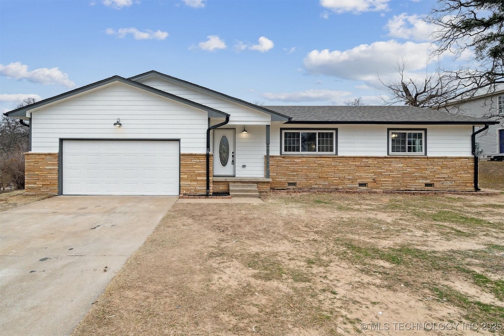 ranch-style house featuring a garage