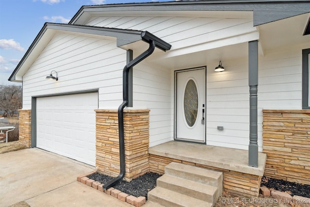 view of exterior entry featuring a garage