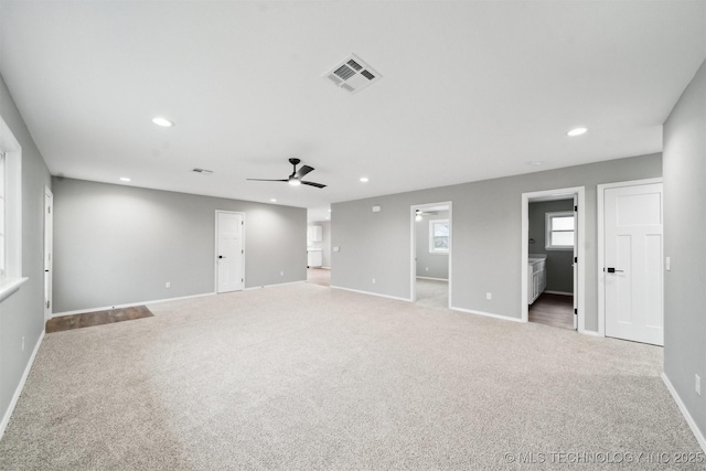 spare room with ceiling fan and carpet flooring