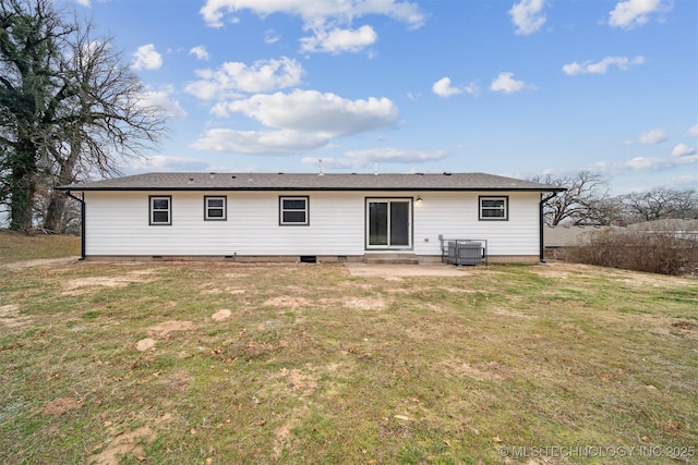 rear view of property featuring central AC, a lawn, and a patio area