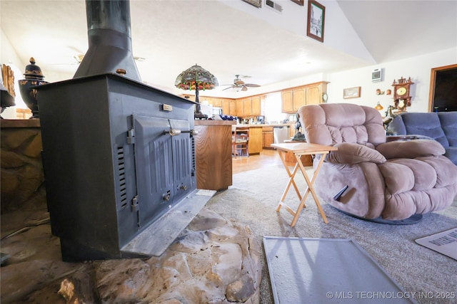 living room with ceiling fan and lofted ceiling