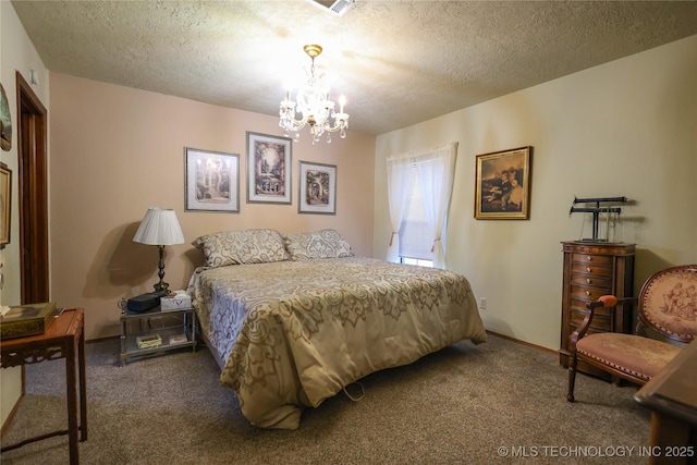 bedroom with a textured ceiling, carpet, and a notable chandelier