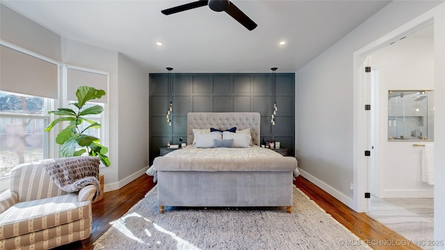 bedroom featuring hardwood / wood-style flooring and ceiling fan