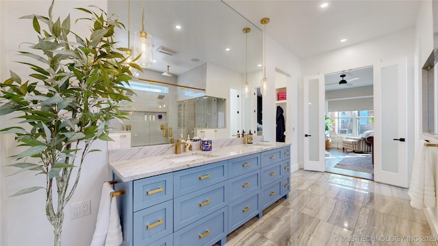 bathroom featuring vanity and an enclosed shower