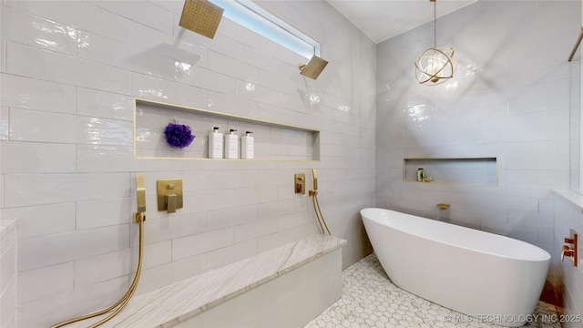 bathroom featuring tile walls and shower with separate bathtub