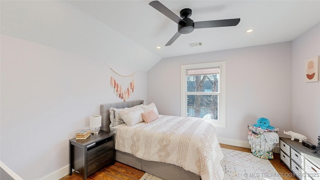 bedroom with lofted ceiling, hardwood / wood-style floors, and ceiling fan