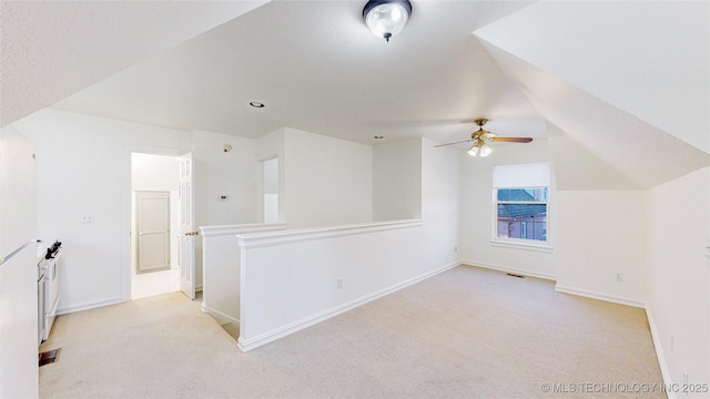 bonus room with light carpet