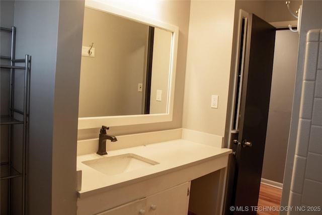 bathroom featuring vanity and hardwood / wood-style floors