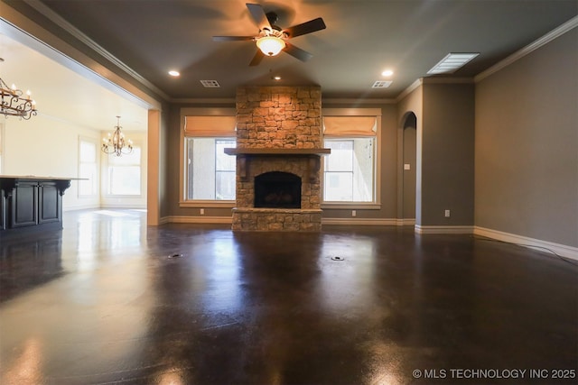 unfurnished living room featuring crown molding, a stone fireplace, and ceiling fan with notable chandelier