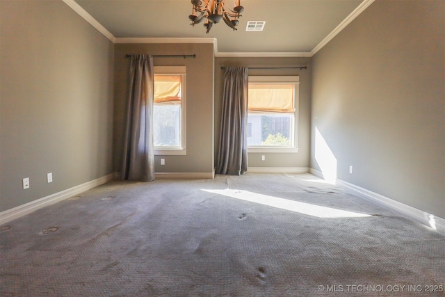 carpeted empty room featuring an inviting chandelier and ornamental molding