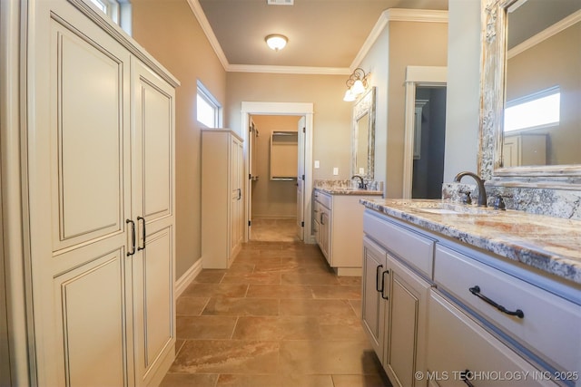 bathroom featuring vanity, tile patterned flooring, and crown molding