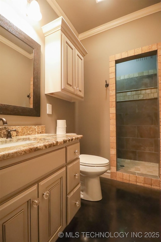 bathroom with vanity, ornamental molding, toilet, and walk in shower