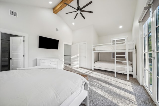 bedroom with beamed ceiling, ceiling fan, carpet floors, and high vaulted ceiling