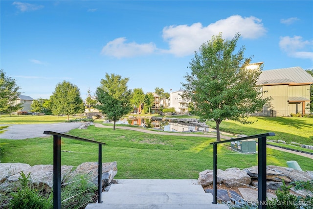 view of home's community featuring a yard