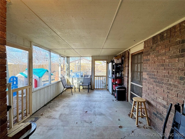 view of unfurnished sunroom