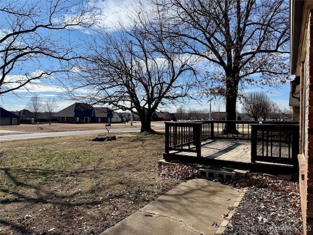 view of yard featuring a wooden deck