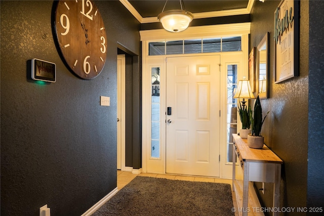 tiled entrance foyer featuring ornamental molding