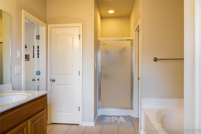 bathroom featuring vanity, shower with separate bathtub, and tile patterned flooring